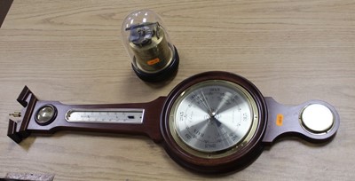 Lot 187 - A reproduction mahogany wheel barometer, the...