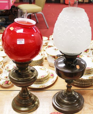 Lot 150 - An early 20th century brass pedestal oil lamp,...