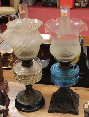 Lot 158 - An early 20th century oil lamp, having a pink...