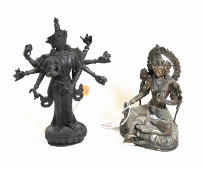Lot 306 - A gilt metal figure of an Eastern deity, in...