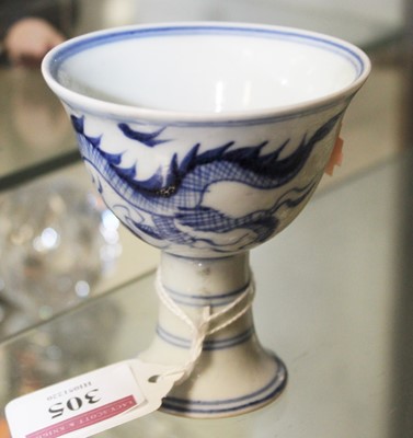 Lot 305 - A Chinese export blue and white 'Dragon' stem...