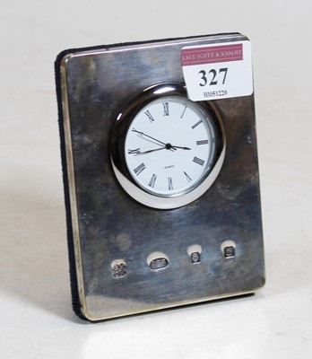 Lot 327 - A modern silver clad easel mantel clock,...