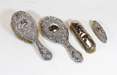 Lot 348 - A circa 1900 silver backed hair brush, having...