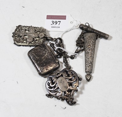 Lot 397 - An Edwardian silver chatelaine, having three...