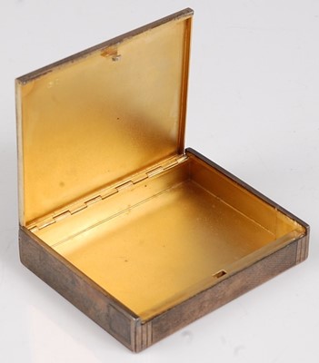 Lot 119 - An Art Deco engine turned silver pocket...