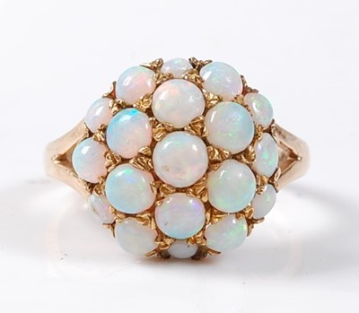 Lot 2509 - A 9ct yellow gold and opal bombe ring,...