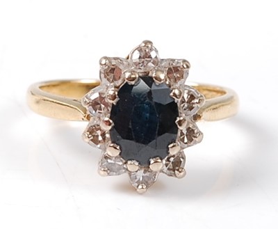 Lot 2530 - An 18ct yellow and white gold, sapphire and...