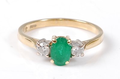 Lot 2522 - An 18ct yellow and white gold, emerald and...