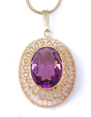 Lot 2544 - A 9ct yellow gold openwork pendant with a...