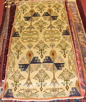 Lot 3 - * A Caucasian woollen rug, the cream ground...
