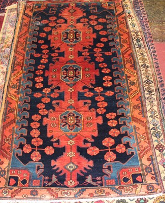 Lot 8 - * A Persian woollen Kazak rug, the blue ground...