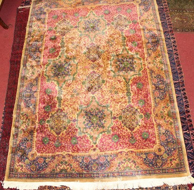 Lot 11 - * An Indo-Persian woollen rug, the beige...