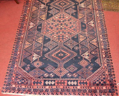 Lot 12 - * A Turkish woollen rug, the blue ground...