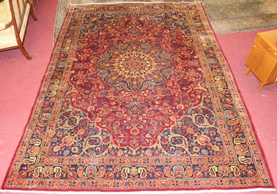 Lot 13 - * A Persian woollen Tabriz style carpet, the...