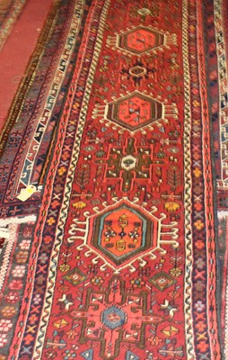 Lot 17 - * A Turkish woollen hall runner, the red...