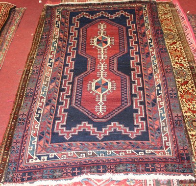 Lot 18 - * A Persian woollen Kazak rug, the deep blue...