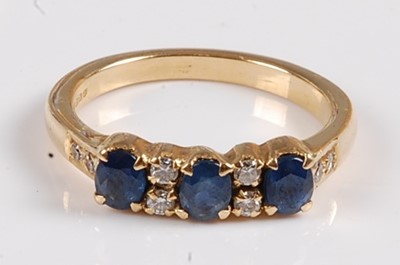 Lot 2549 - An 18ct yellow gold, sapphire and diamond half...