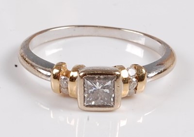 Lot 2558 - An 18ct white and yellow gold, diamond single...
