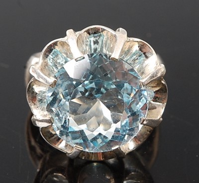Lot 2574 - A white metal blue topaz single stone ring,...