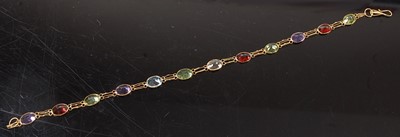 Lot 2598 - A yellow metal multi-stone bracelet,...