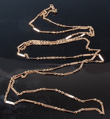 Lot 2590 - A yellow metal long guard chain, with...
