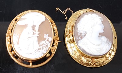 Lot 2592 - Two yellow metal large shell cameo brooches,...