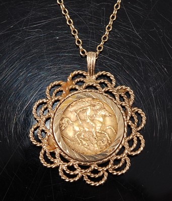 Lot 2593 - A  George V gold half sovereign within a 9ct...