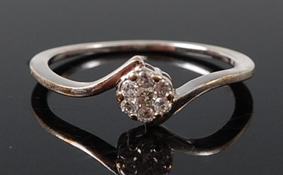 Lot 2595 - A 9ct white gold diamond circular cluster ring,...