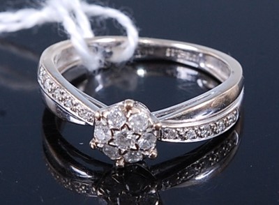 Lot 2605 - A 9ct white gold diamond circular cluster ring,...