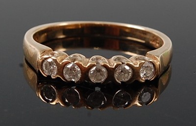 Lot 2606 - A 9ct yellow gold diamond half hoop eternity...