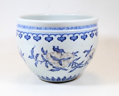 Lot 2 - A Chinese stoneware blue and white jardinière,...