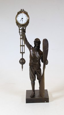Lot 40 - A modern bronzed mystery clock in the form of...