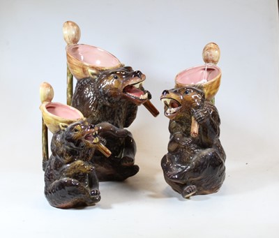 Lot 43 - A graduated set of three majolica style jugs,...