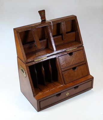 Lot 64 - A modern tan leather clad stationery cabinet,...