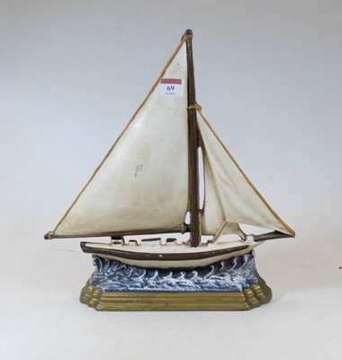 Lot 69 - A reproduction cast iron door stop in the form...