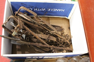 Lot 75 - A cast iron gin trap, having 10cm square...