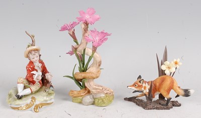 Lot 224 - A Capo di Monte porcelain figure of a seated...