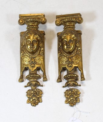Lot 251 - A pair of gilt metal mask furniture mounts,...