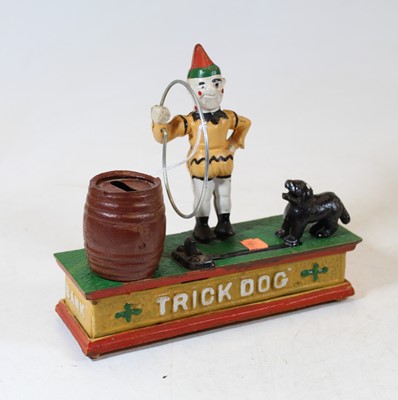 Lot 242 - A reproduction cast iron trick dog novelty...