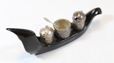 Lot 335 - An Eastern white metal three-piece cruet,...