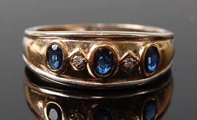 Lot 2612 - A 9ct yellow and white gold, sapphire and...