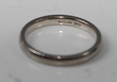 Lot 2633 - A Palladium 2.4mm court shaped wedding band,...