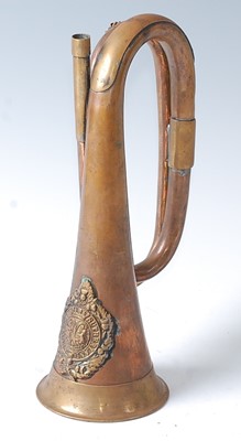 Lot 2409 - A copper and brass bugle with applied badge of...