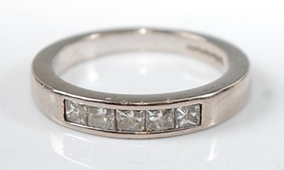 Lot 2636 - An 18ct white gold diamond half hoop eternity...