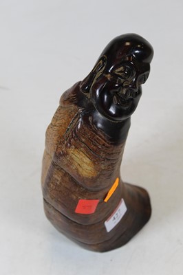 Lot 427 - A modern horn carving of a Buddha, height 24cm