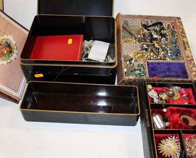 Lot 485 - A black lacquered box and contents, to include...