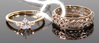 Lot 367 - A modern yellow metal and cz set dress ring,...
