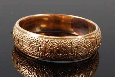 Lot 2668 - A yellow metal 4.5mm D shaped wedding band...