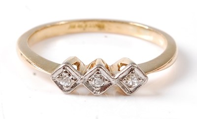 Lot 2676 - A yellow and white metal diamond three stone...