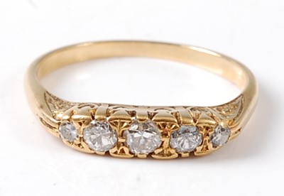 Lot 2700 - A yellow metal diamond five stone half hoop...